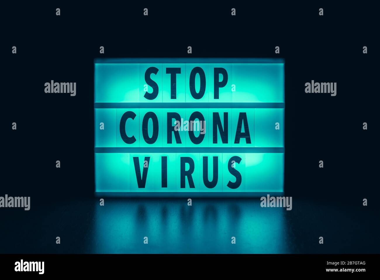 'Stop Corona Virus' written in a lightbox text Stock Photo
