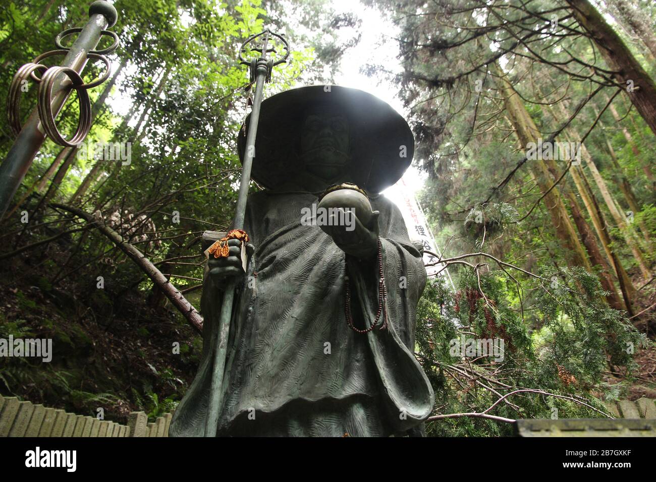Buddhist statue in japanese forest Stock Photo Alamy