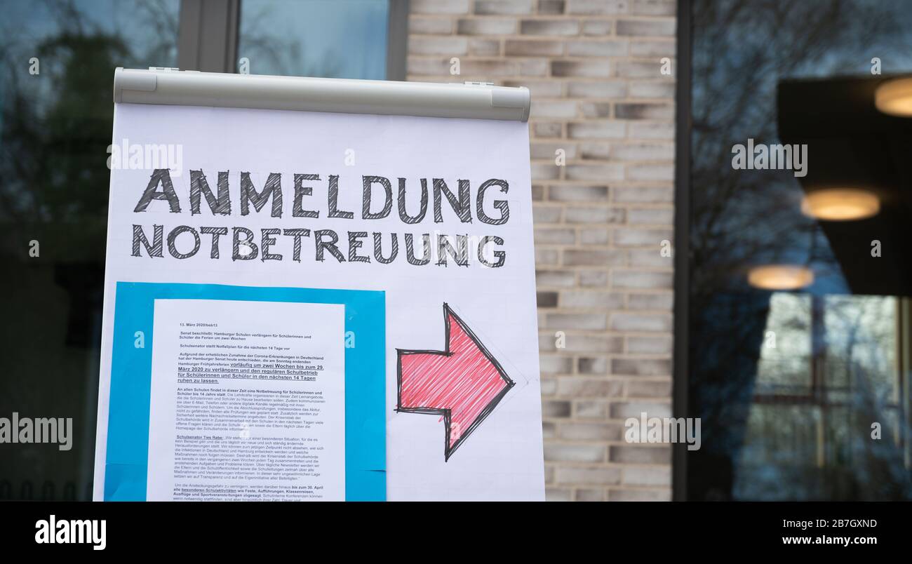 Hamburg, Germany. 16th Mar, 2020. A flipchart with the inscription 'Anmeldung Notbetreuung' is located on the grounds of the primary school Hoheluft. Due to the corona virus, all schools and day-care centres in the Hanseatic city are closed. Credit: Daniel Reinhardt/dpa/Alamy Live News Stock Photo