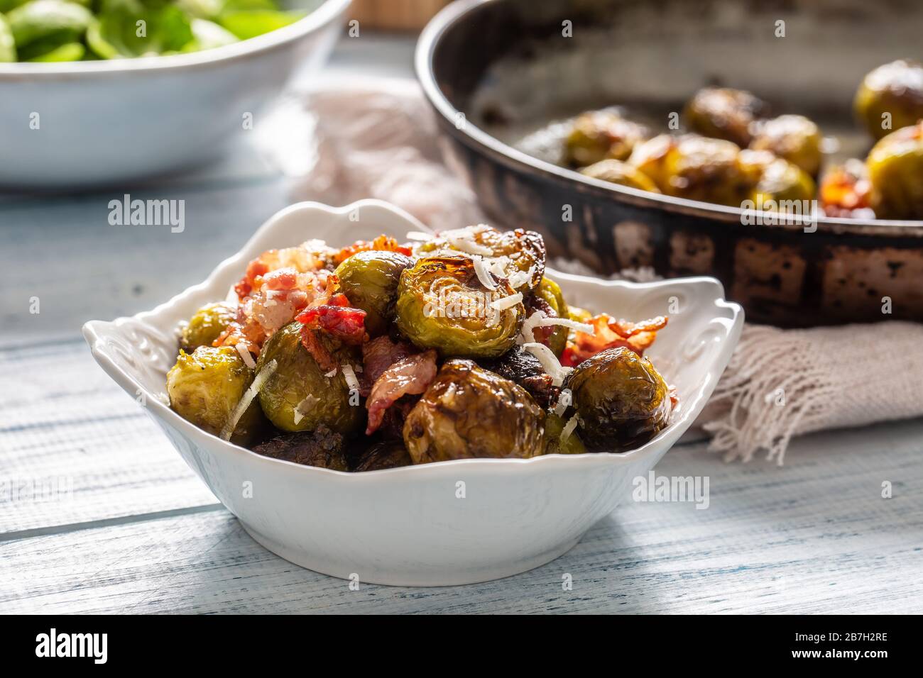 Fried brussels sprout with roasted bacon and parmesan cheese Stock Photo