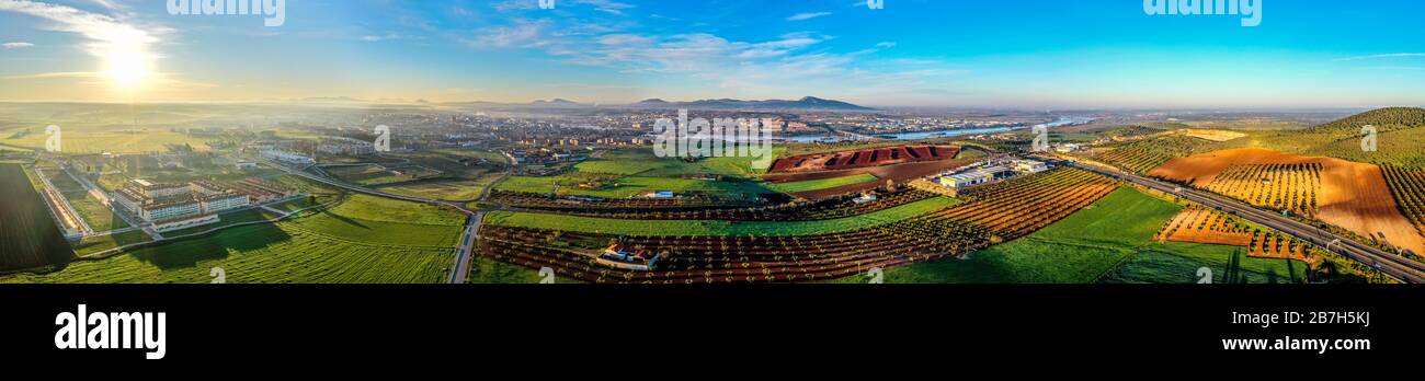 Aerial panoramic view of modern Merida cityscape on banks of Guadiana River. Spain Stock Photo