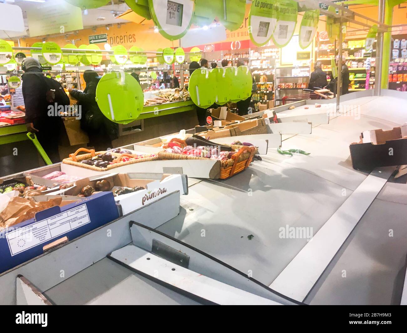 Covid-19 (Coronavitus) crisis: the fruits and vegetables shelves of a supermarket emptied by anxious citizens, Lyon, France Stock Photo