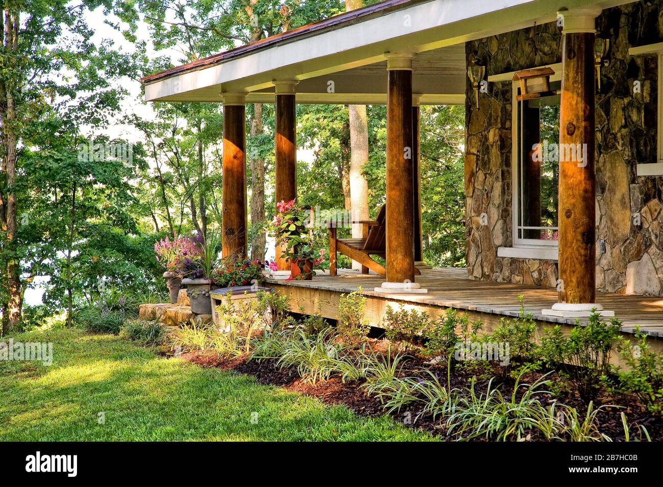 Long porch, thick wood columns Stock Photo Alamy