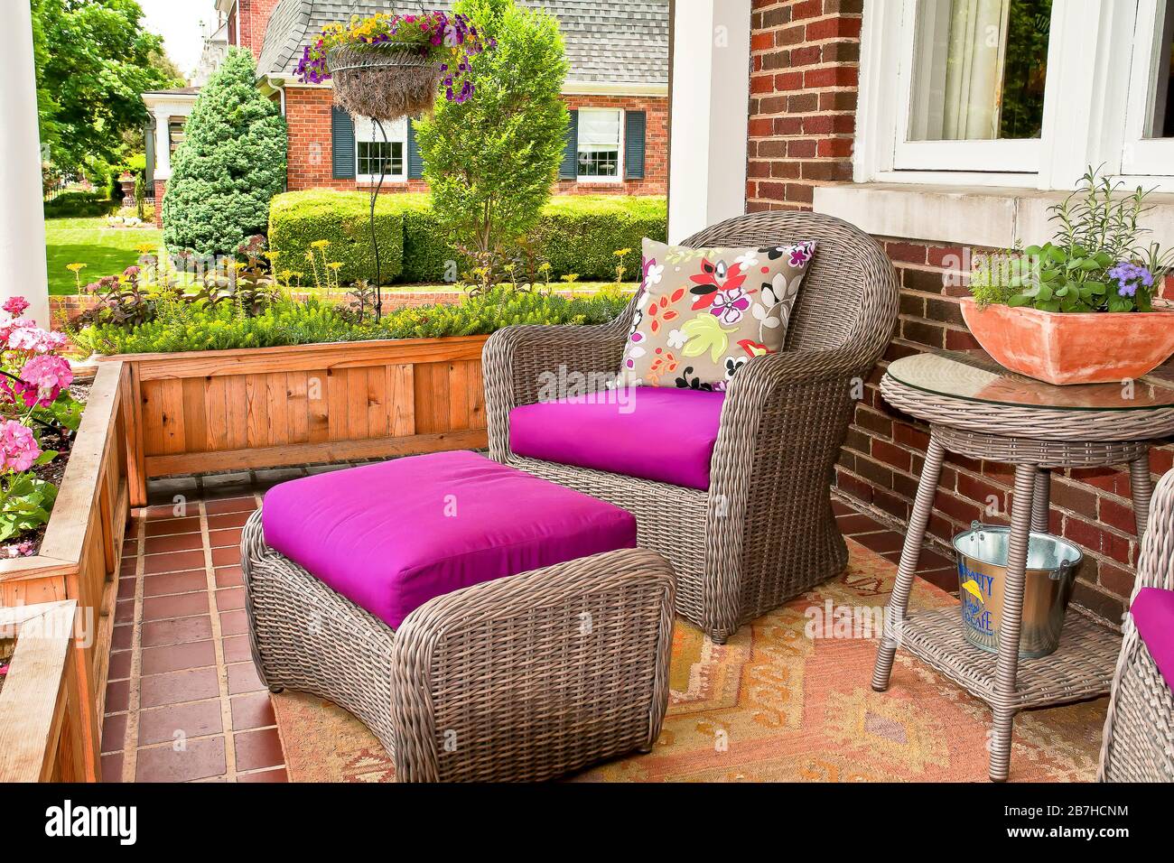 Furnished Front Porch with flower garden Stock Photo