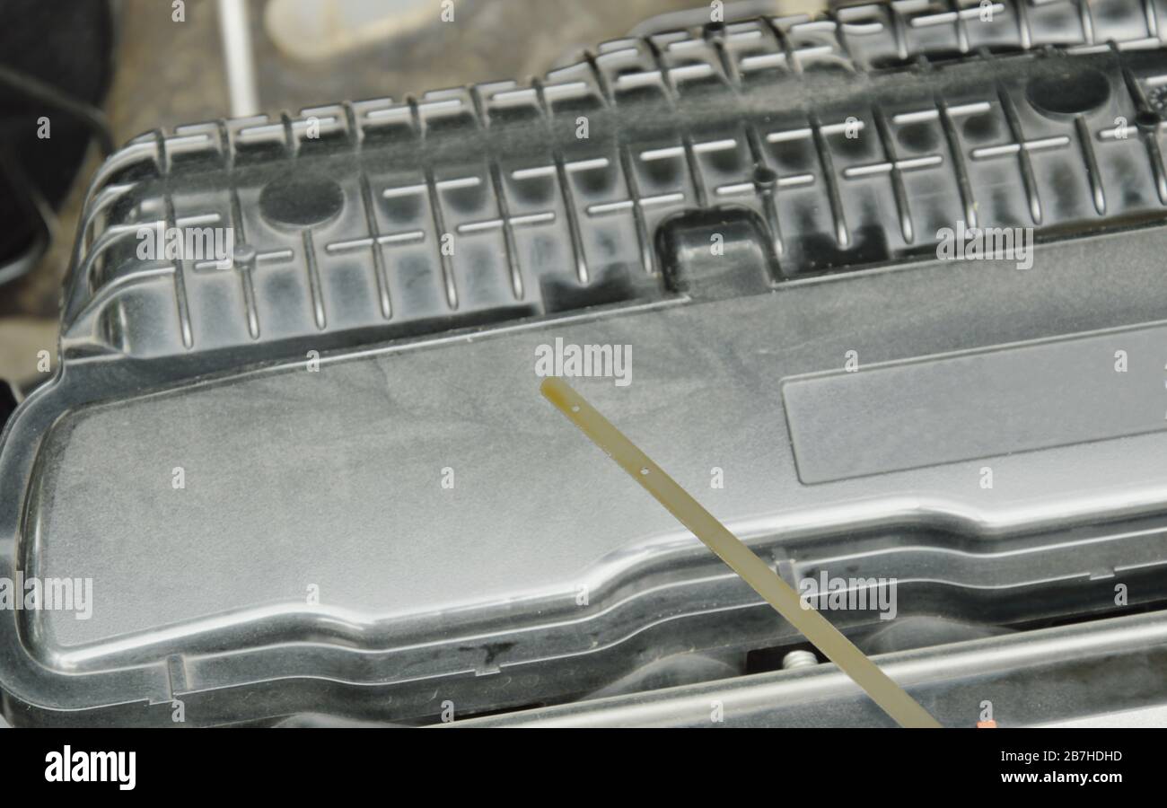 oil gauge stick for checking lubricant level in car engine Stock Photo