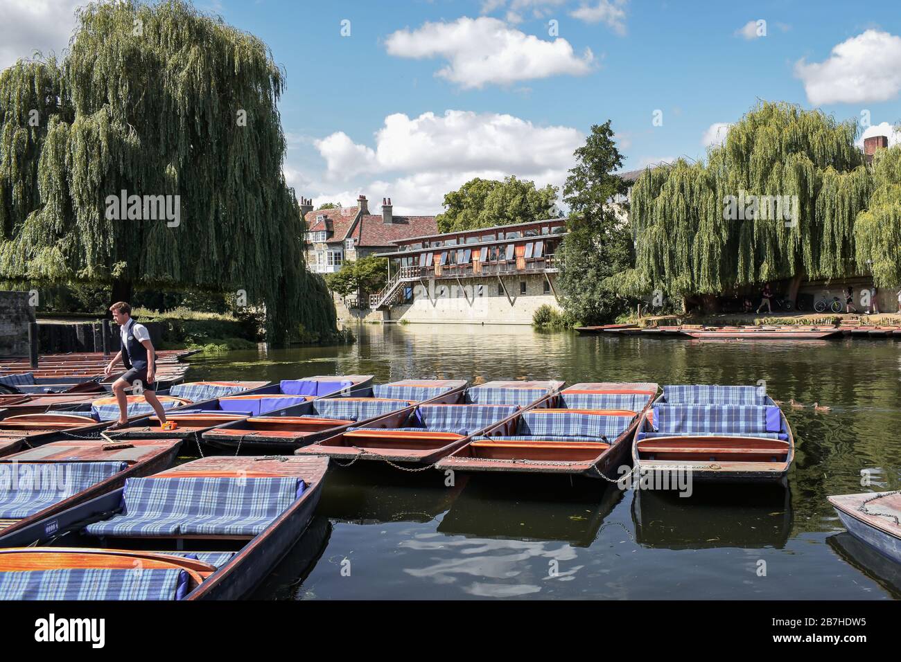 Cambridge, Cambridgeshire, United Kingdom - Tourists on punt trip (sightseeing with boat) along River Cam in the city of Cambridge, Unite Stock Photo