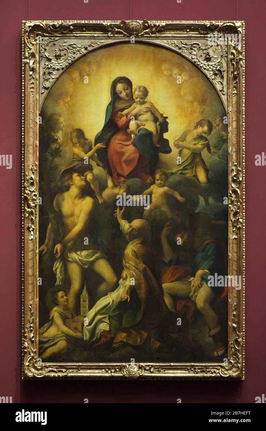 Altar painting 'Madonna of Saint Sebastian' by Italian Renaissance painter Correggio (circa 1524) on display in the Gemäldegalerie Alte Meister (Old Masters Gallery) in Dresden, Germany. Stock Photo