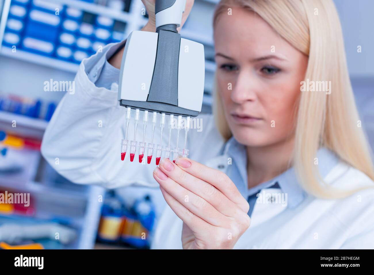 Girl laboratory Assistant works with an antiviral drug in a