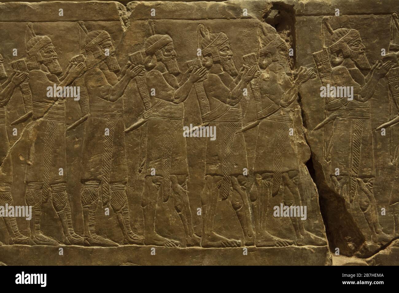 Assyrian army during the campaign of King Ashurbanipal against Elam depicted in the Assyrian relief from the King Ashurbanipal Palace in Nineveh dated from 645 BC on display in the Louvre Museum in Paris, France. Stock Photo