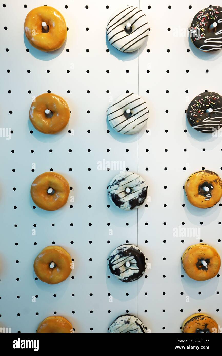 Artificial donuts decorated on the wall Stock Photo