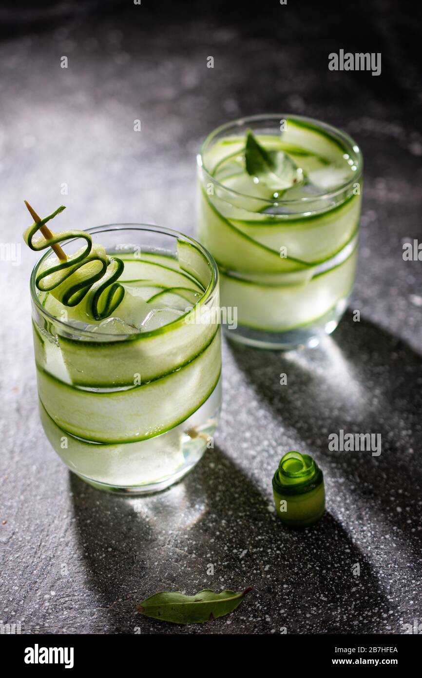 Drinking cucumber water.Refreshing vegetable drink.low fat food and drink.Delicious breakfast. Stock Photo