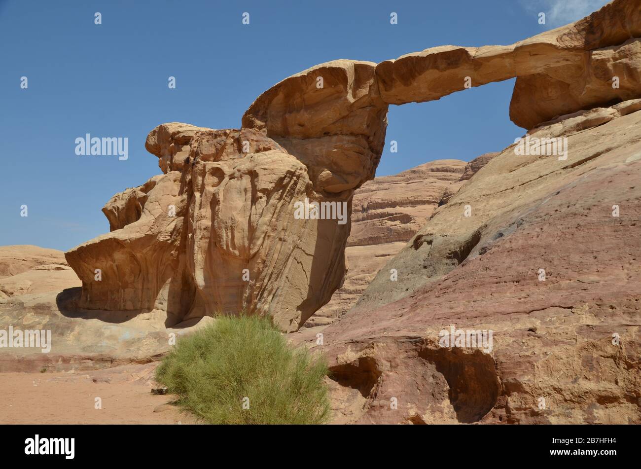 Natural rock bridge in Wadi Rum Stock Photo