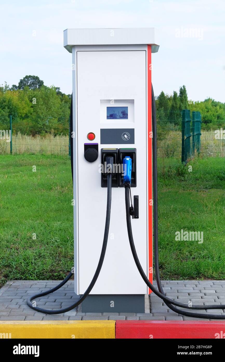 Electric charging station. Eco friendly transport concept. Vertical view. Stock Photo