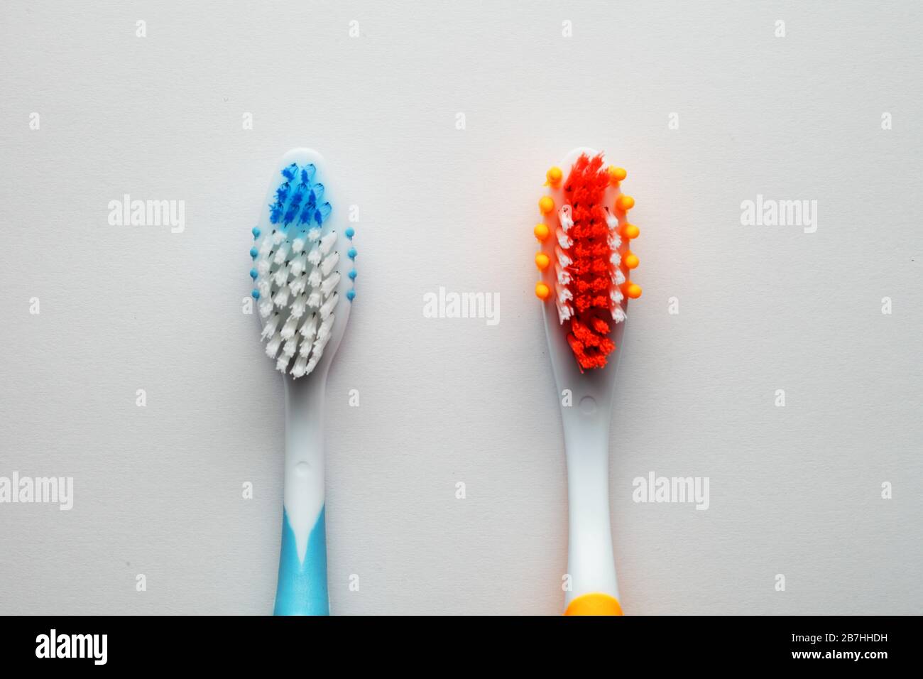 two new toothbrushes on a white background Stock Photo - Alamy