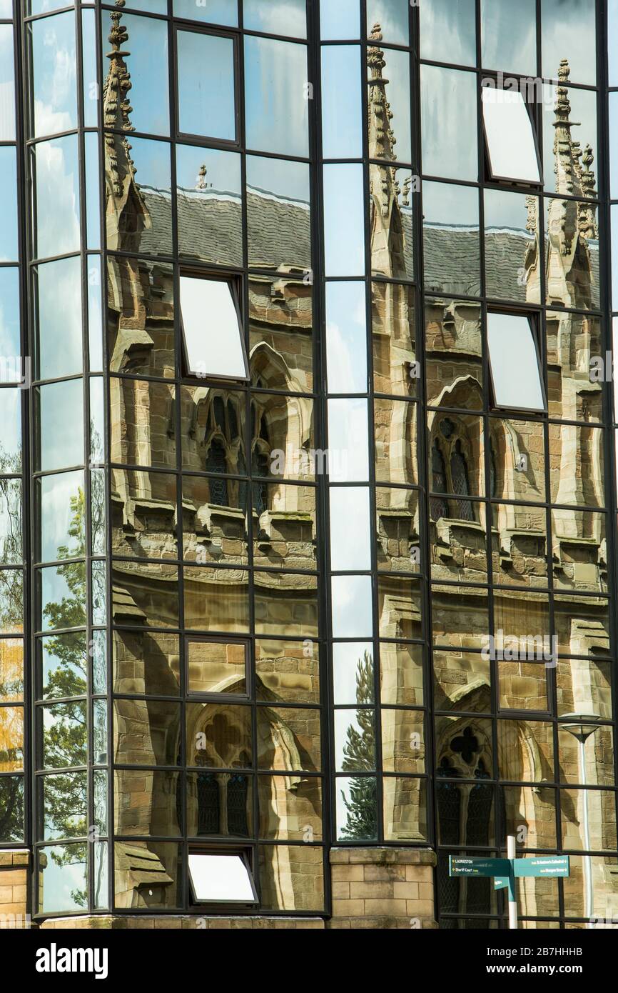 St Andrews Roman Catholic Cathedral reflected in the glass windows of a modern building, Glasgow, Scotland, UK Stock Photo