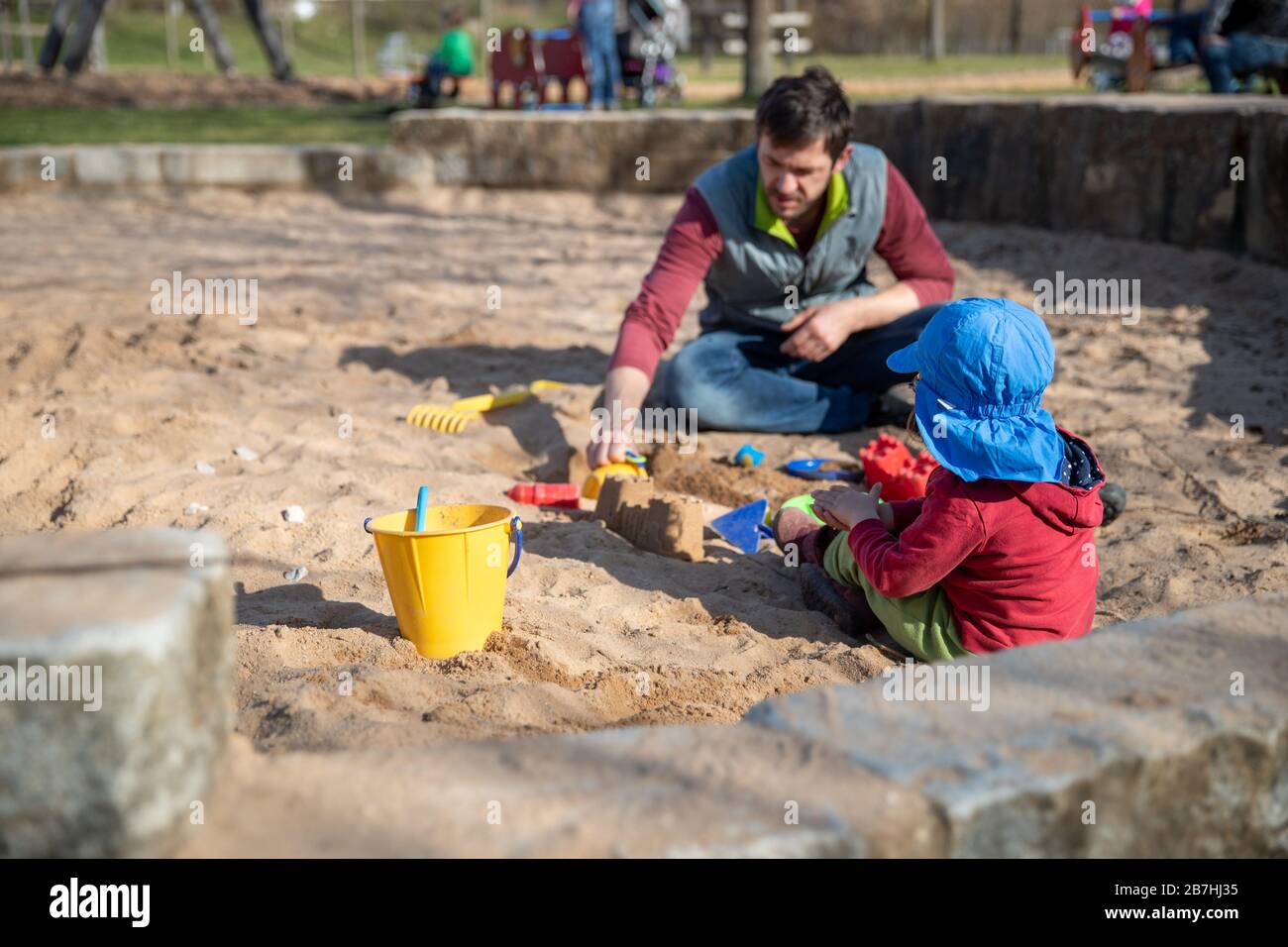 Nuremberg Germany 16th Mar A Man And A Child Play In A Sandbox On A