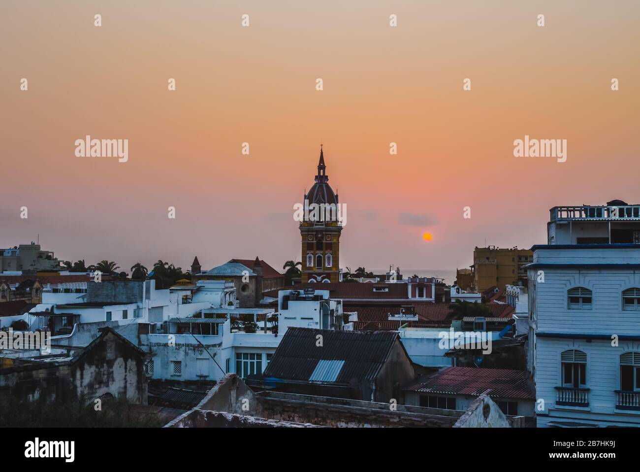 Cityscape skyline of the clocktower of Cartagena de Indias, Colombia, during a beautiful sunset Stock Photo