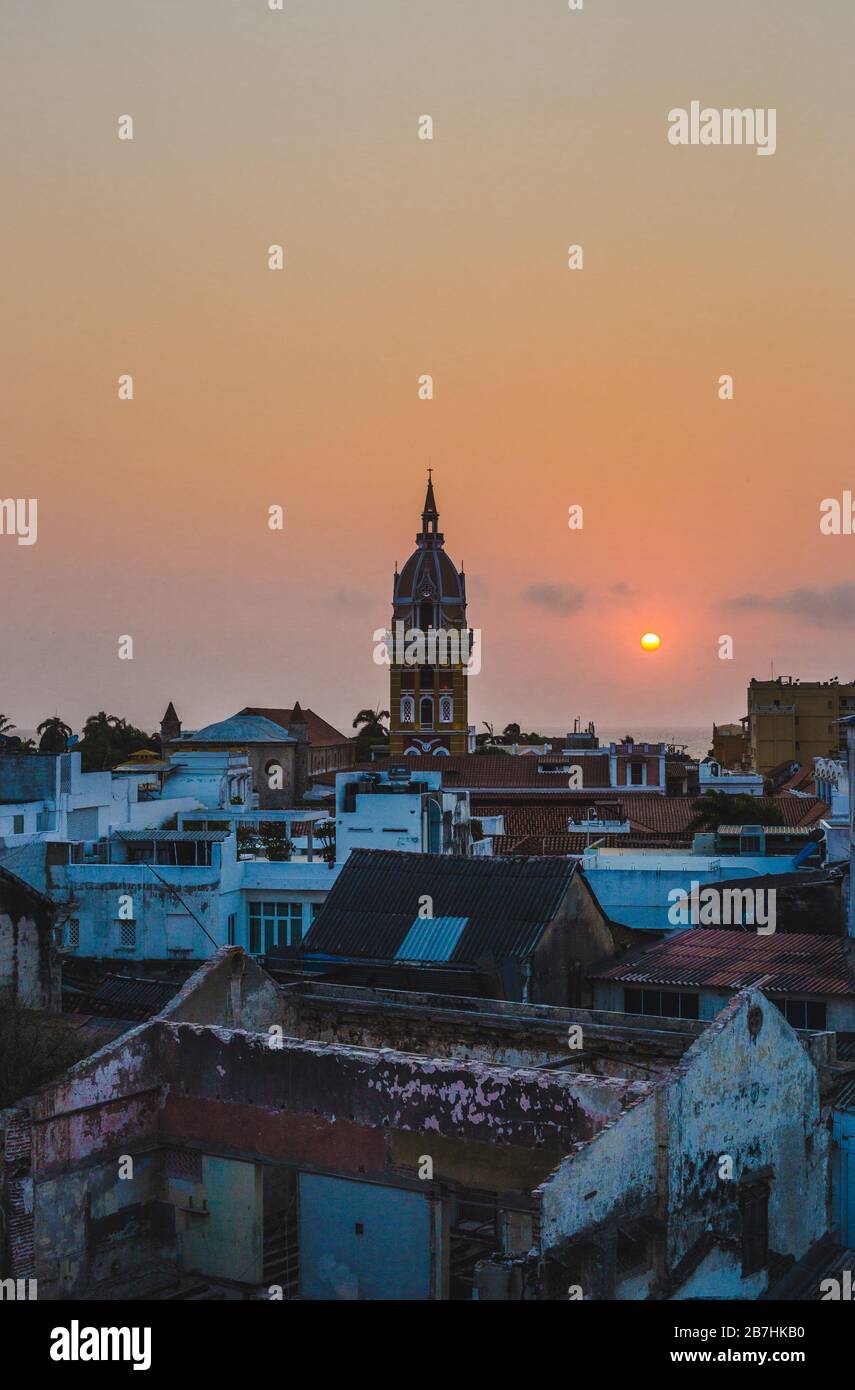 Cityscape skyline of the clocktower of Cartagena de Indias, Colombia, during a beautiful sunset Stock Photo