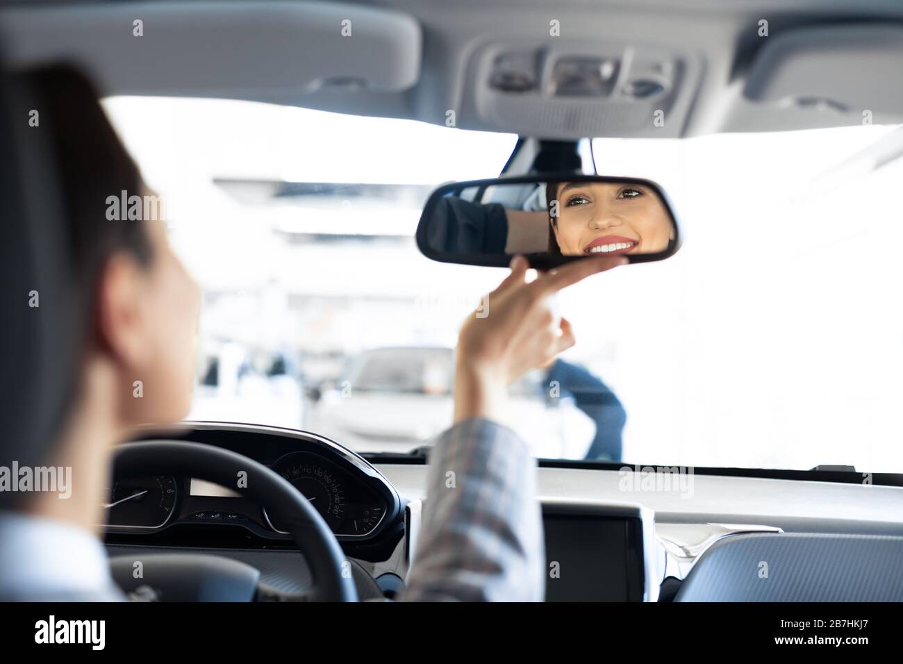 Girl Checking Mirrors Sitting In Driver's Seat Stock Photo Alamy