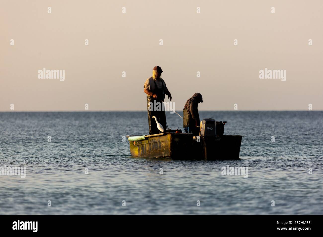 Fishermen cast their nets into the Gulf of Mexico off of Lido Beach, Sarasota, Florida. Stock Photo