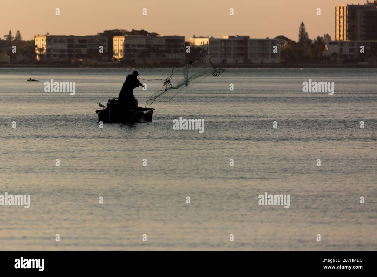 Fishermen cast their nets into the Gulf of Mexico off of Lido Beach, Sarasota, Florida. Stock Photo