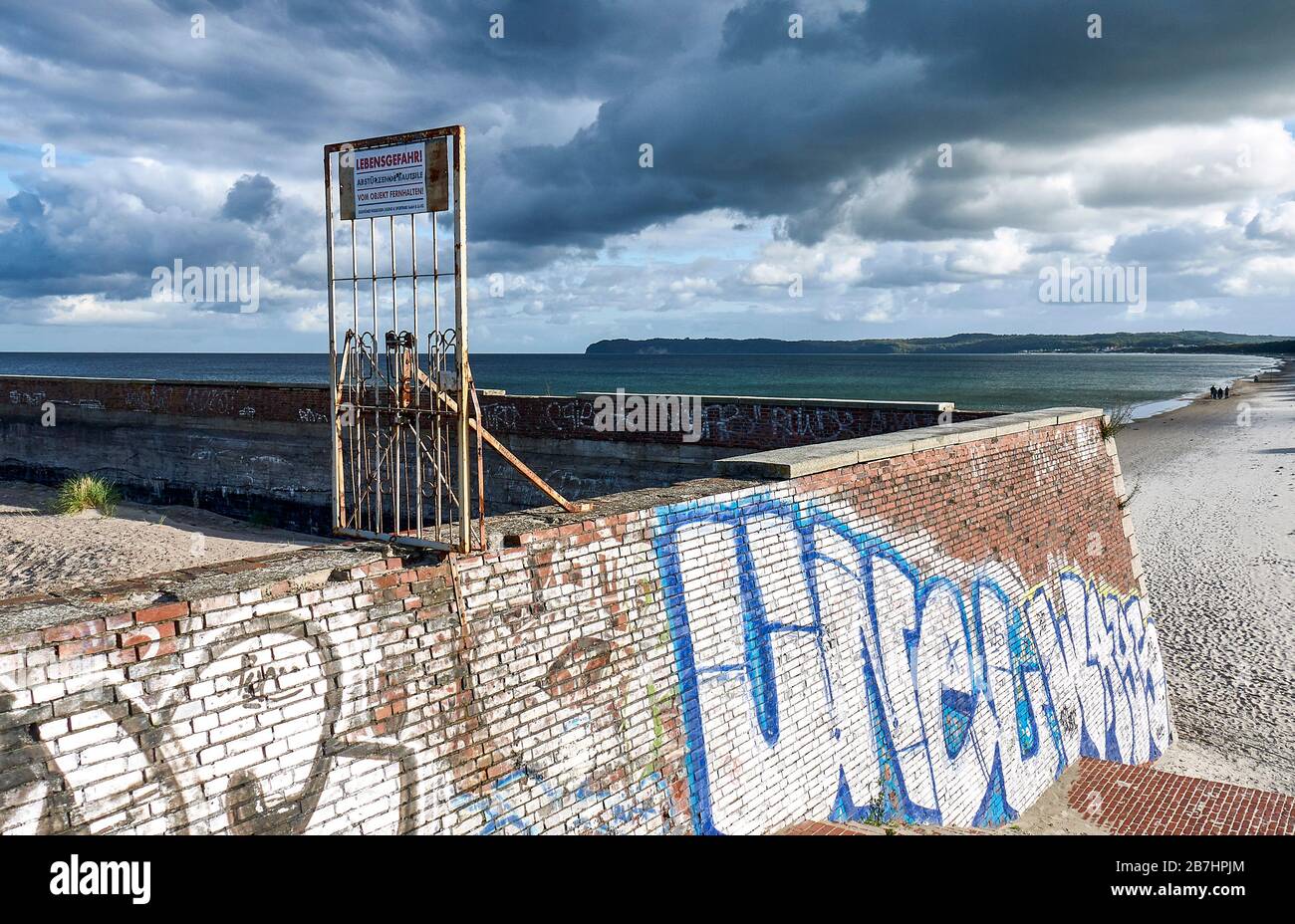 Danger of life, a sign warns to enter the wall at the beach of Prora on the island of Ruegen. Stock Photo