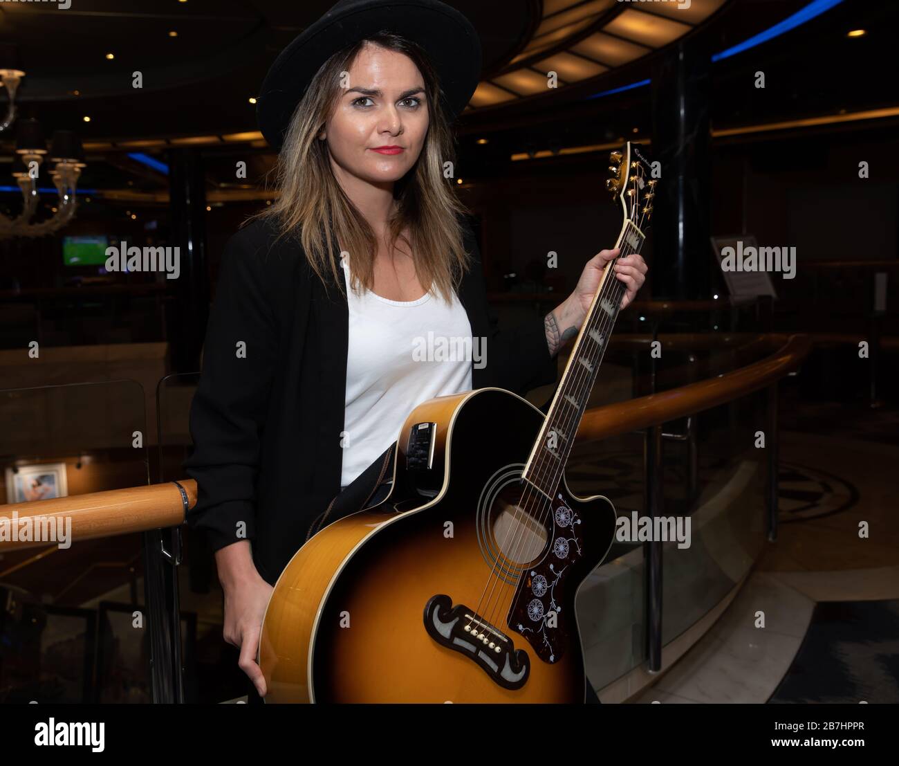 Angela Grace Brown Singer And Guitarist Posing In The Atrium Onboard Oceana Stock Photo Alamy