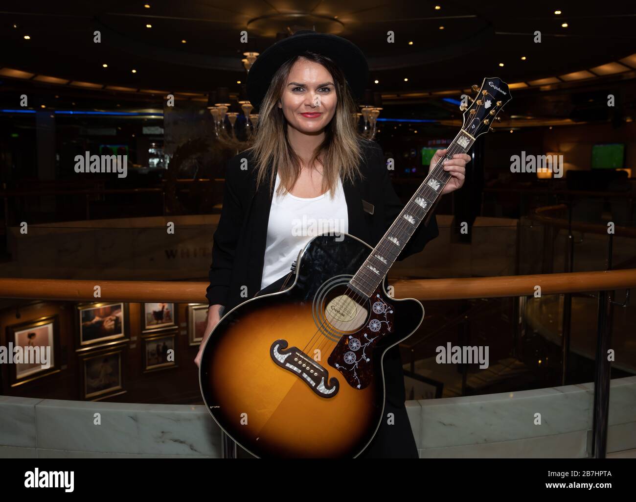 Angela Grace Brown Singer And Guitarist Posing In The Atrium Onboard Oceana Stock Photo Alamy