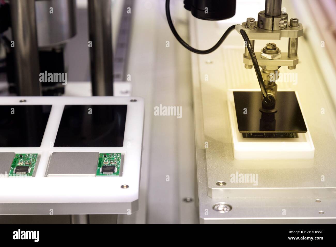 automatic robot arm with vacuum sucker working in production line and  assembling smartphone screens in new innovative and high technology  smartphoe Stock Photo - Alamy