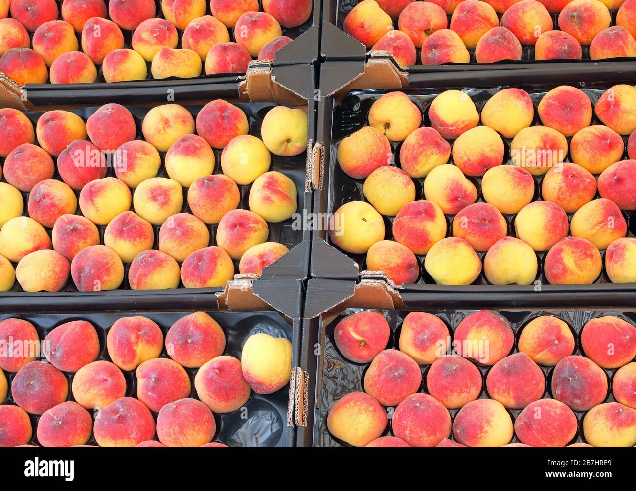 peaches for sale at grocery store in summer Stock Photo Alamy