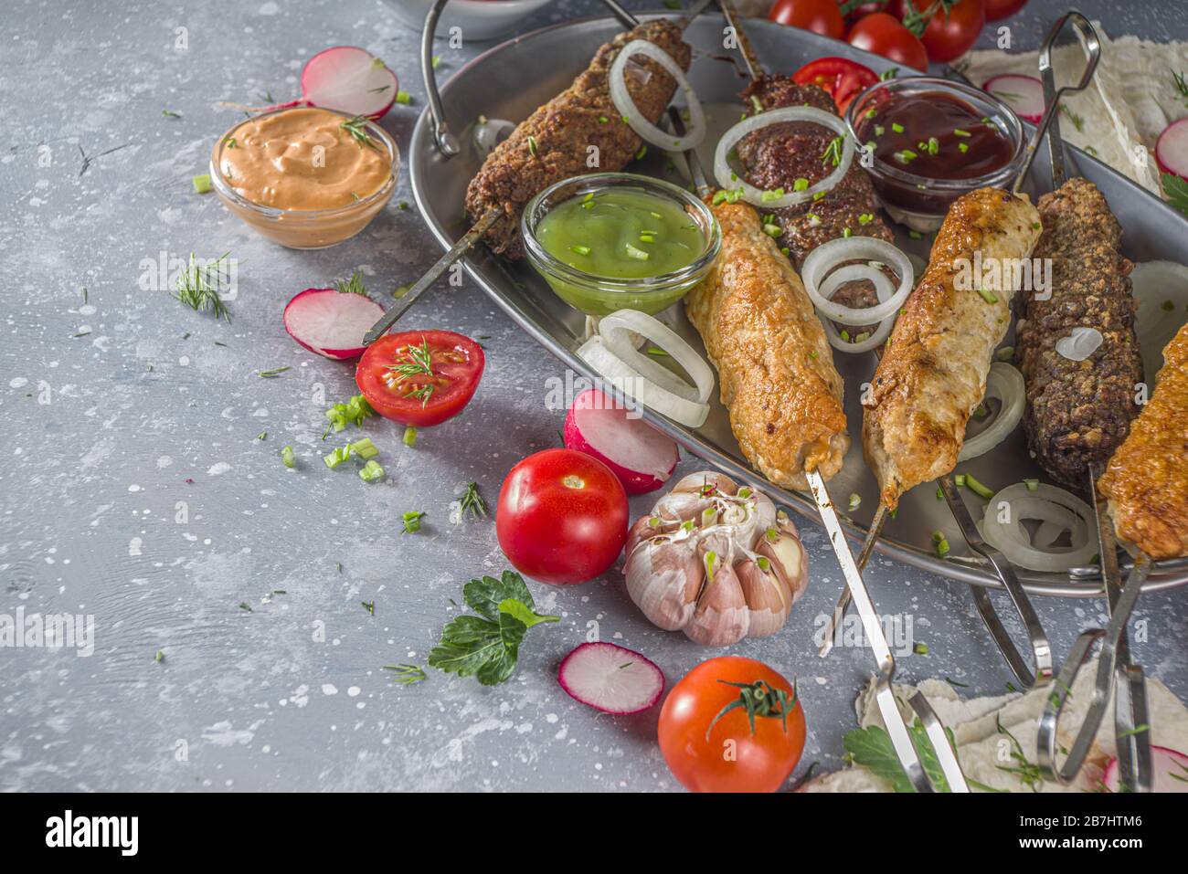Summer bbq party. Shish kebab on a stick, from ground beef and chicken