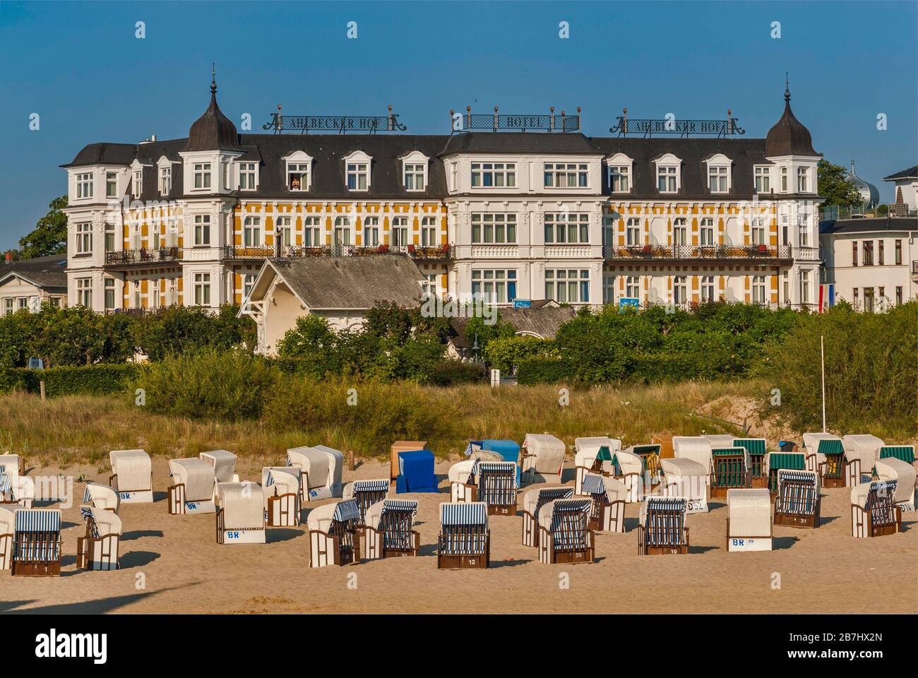 Hotel Ahlbecker Hof and wicker beach chairs on beach seen from Seebrücke pier in Ahlbeck at Usedom Island in Mecklenburg-West Pomerania, Germany Stock Photo