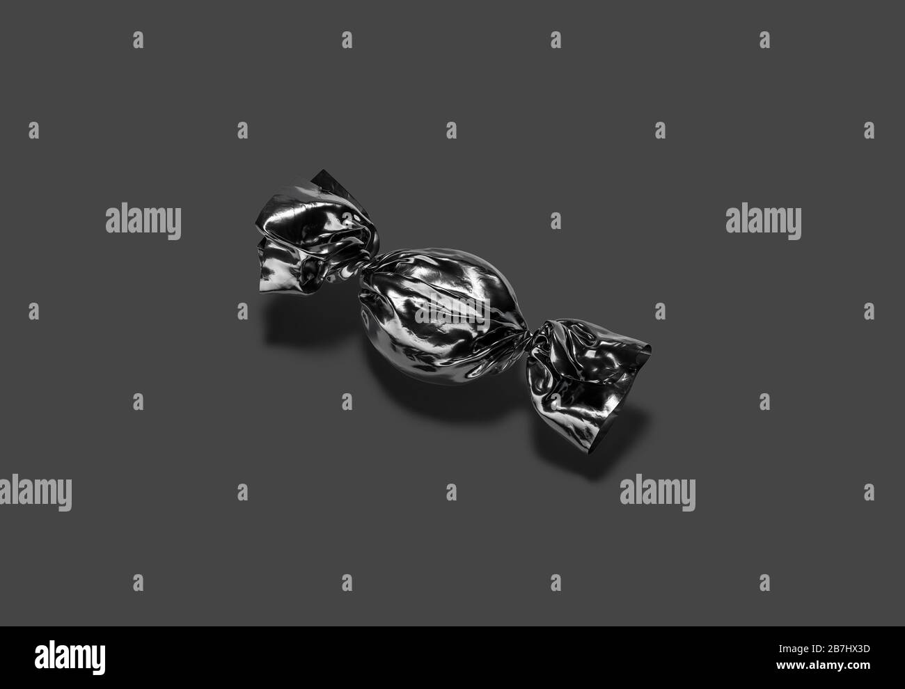 Blank black hadn candy foil wrapper mock up, dark background Stock Photo