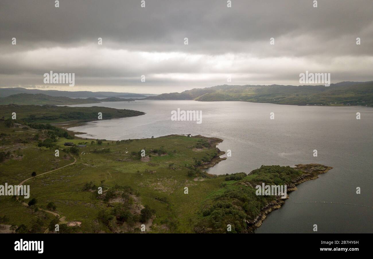 Loch Torridon, Scottish Highlands. An aerial view over Loch Torridon in the northwest of Scotland with the sun struggling to break through the clouds. Stock Photo