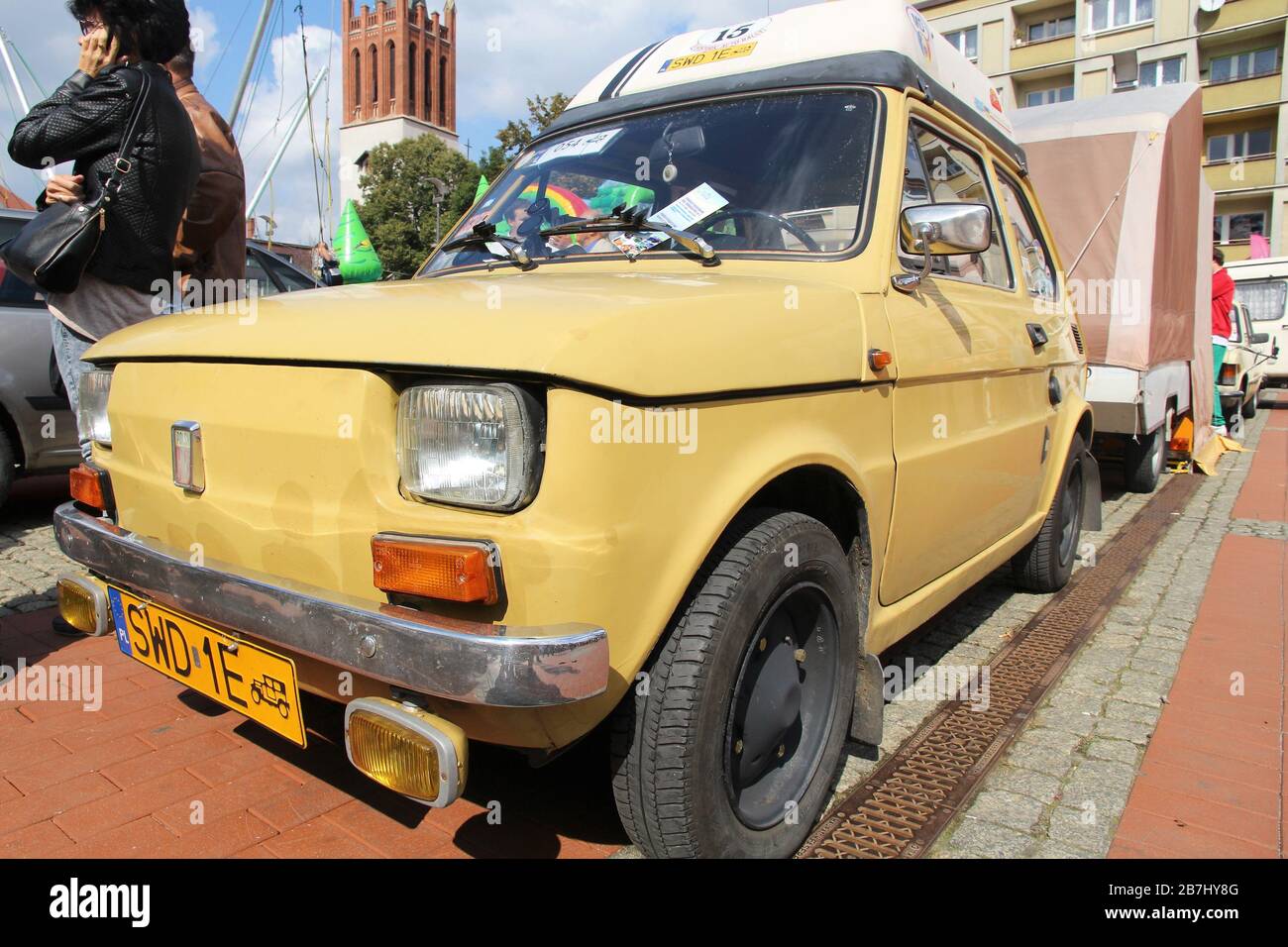 BYTOM, POLAND - SEPTEMBER 12, 2015: People admire Polski Fiat 126p during 12th Historic Vehicle Rally in Bytom. The annual vehicle parade is one of ma Stock Photo