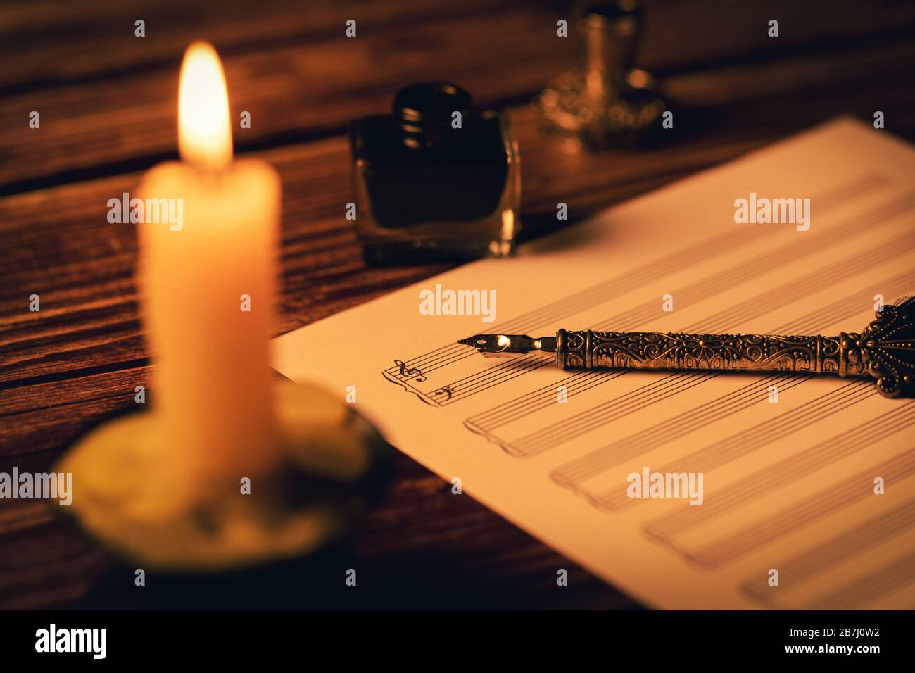 vintage manuscript - writing musical notes in candlelight Stock Photo