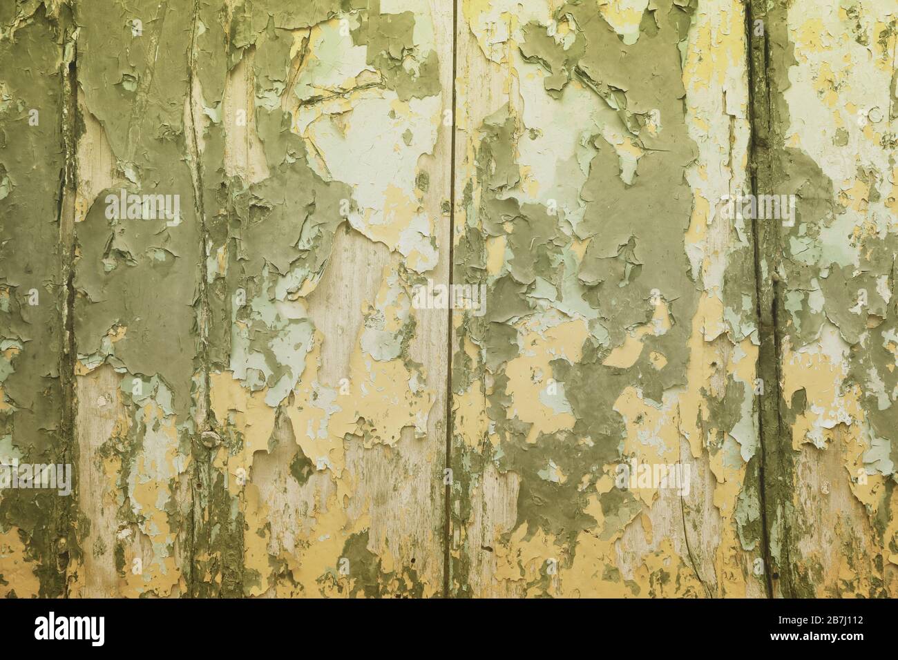 Peeling paint vintage texture. Grunge style old wooden door background. Stock Photo