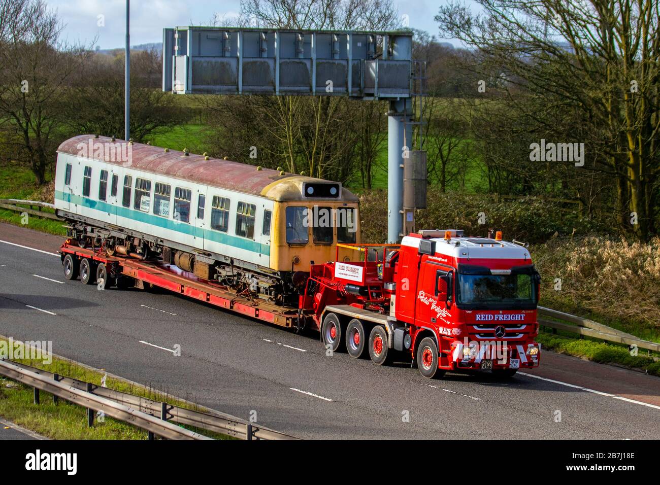 Reid Freight Heavy haulage; Longer Heavier Vehicles with trailer (LHVs) carrying old restorable railway carriages for restoration by a train PWRS. Poulton & Wyre Railway preservation society. Stock Photo