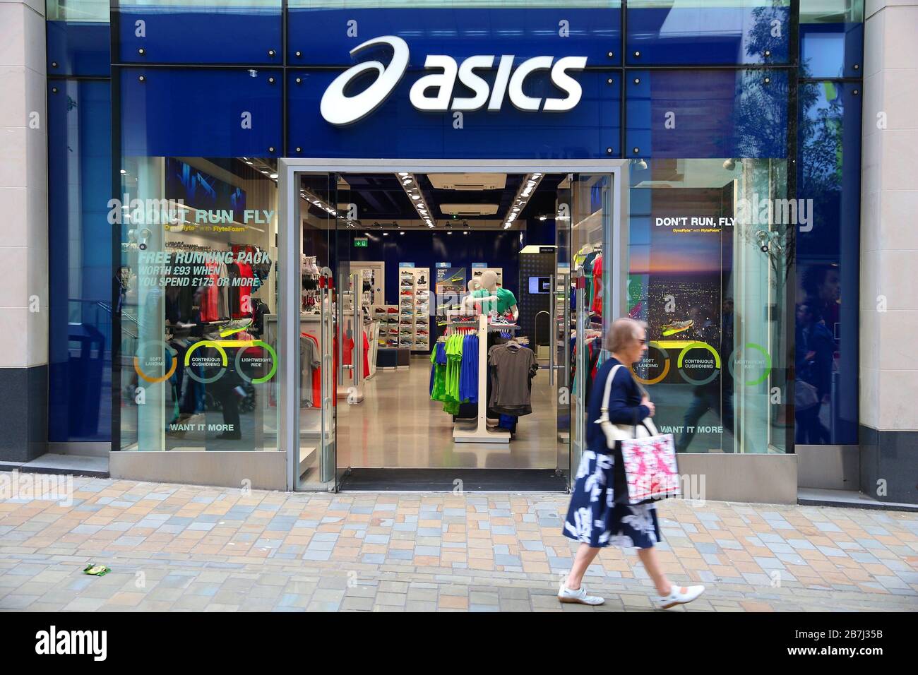 LEEDS, UK - JULY 12, 2016: People walk by Asics store in Leeds, UK. Asics  is a Japanese sportswear and footwear producer since 1949 Stock Photo -  Alamy
