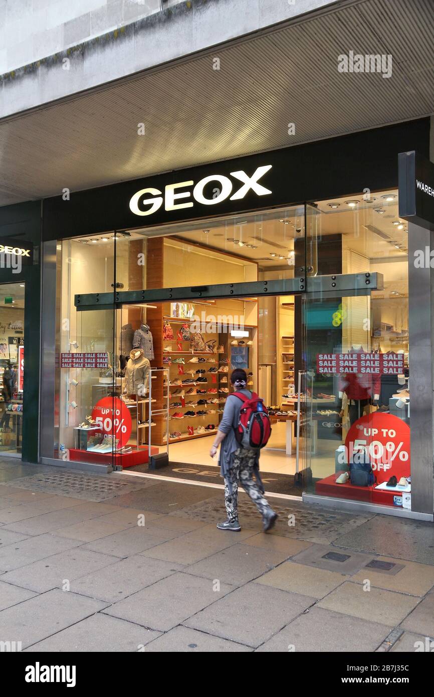 LONDON, UK JULY 6, 2016: People shop at Geox footwear store Oxford Street in Oxford Street has approximately half a daily visitors a Stock Photo Alamy