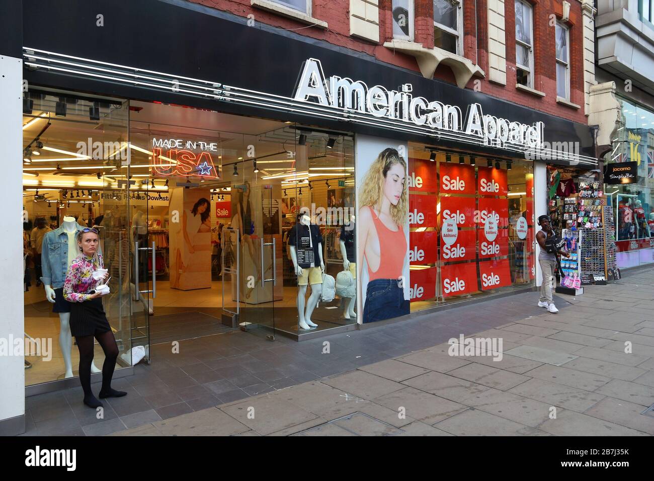 LONDON, UK - JULY 6, 2016: People shop at American Apparel, Oxford Street in London. Oxford Street has approximately half a million daily visitors and Stock Photo