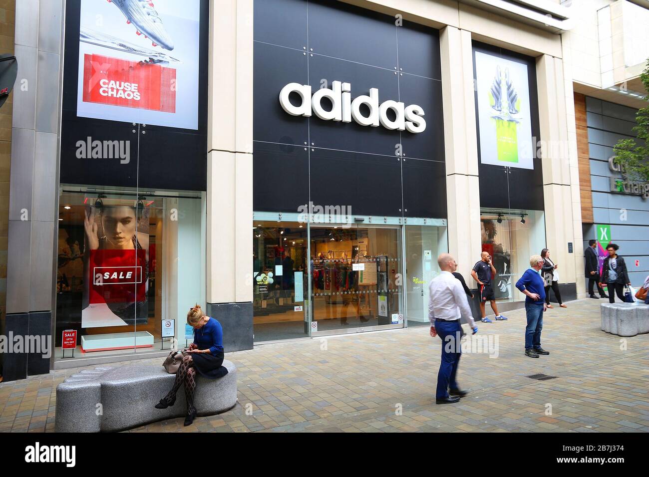 LEEDS, UK - JULY 12, 2016: People walk by Adidas store in Leeds, UK. Adidas  corporation exists since 1924 and had EUR 14.5bn revenue in 2012 Stock  Photo - Alamy