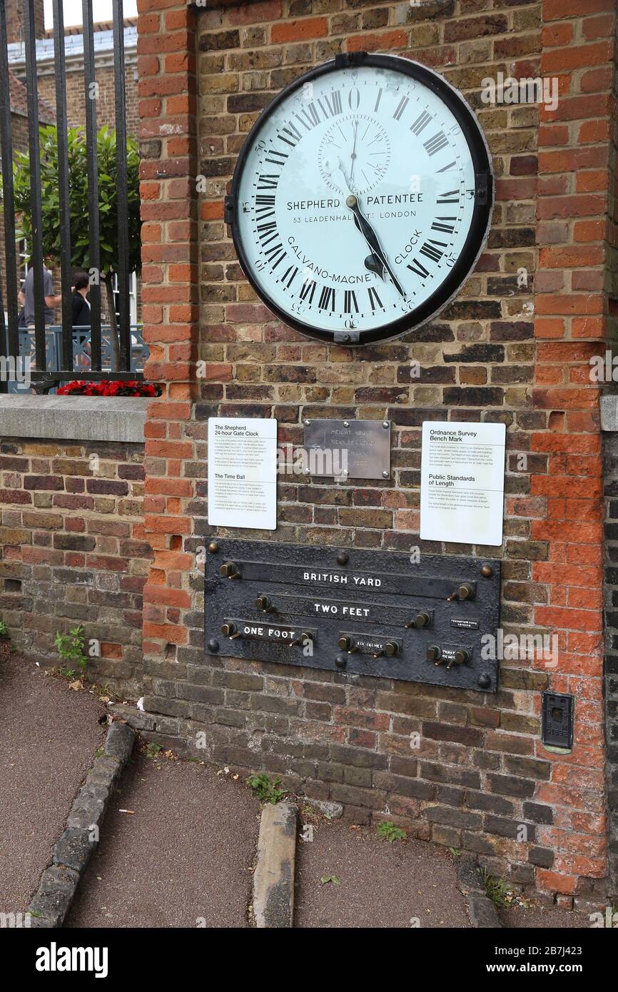 LONDON, UK - JULY 8, 2016: Shepherd Gate Clock and length standards in Greenwich, London, UK. The clock displays official Greenwich Mean Time (GMT). Stock Photo