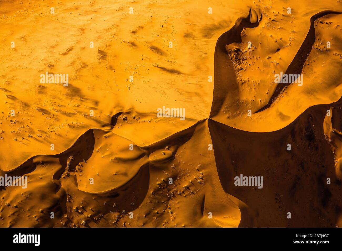 Sand dunes of Namib desert from aircraft on Skeleton coast in Namibia. Stock Photo