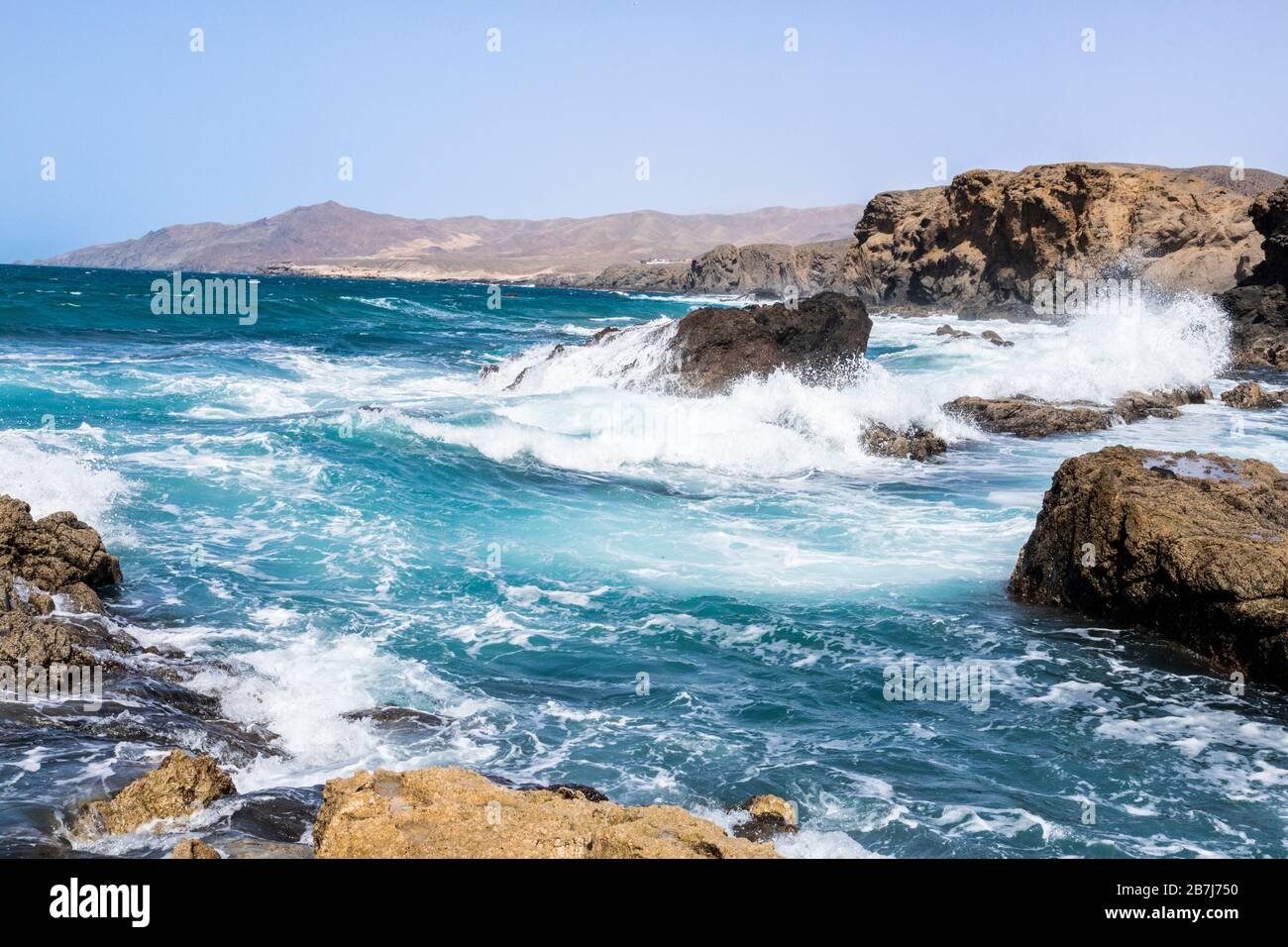 Heavy Atlantic waves breaking on rocks on the beach at La Pared on the west coast of the Canary Island of Fuerteventura Stock Photo