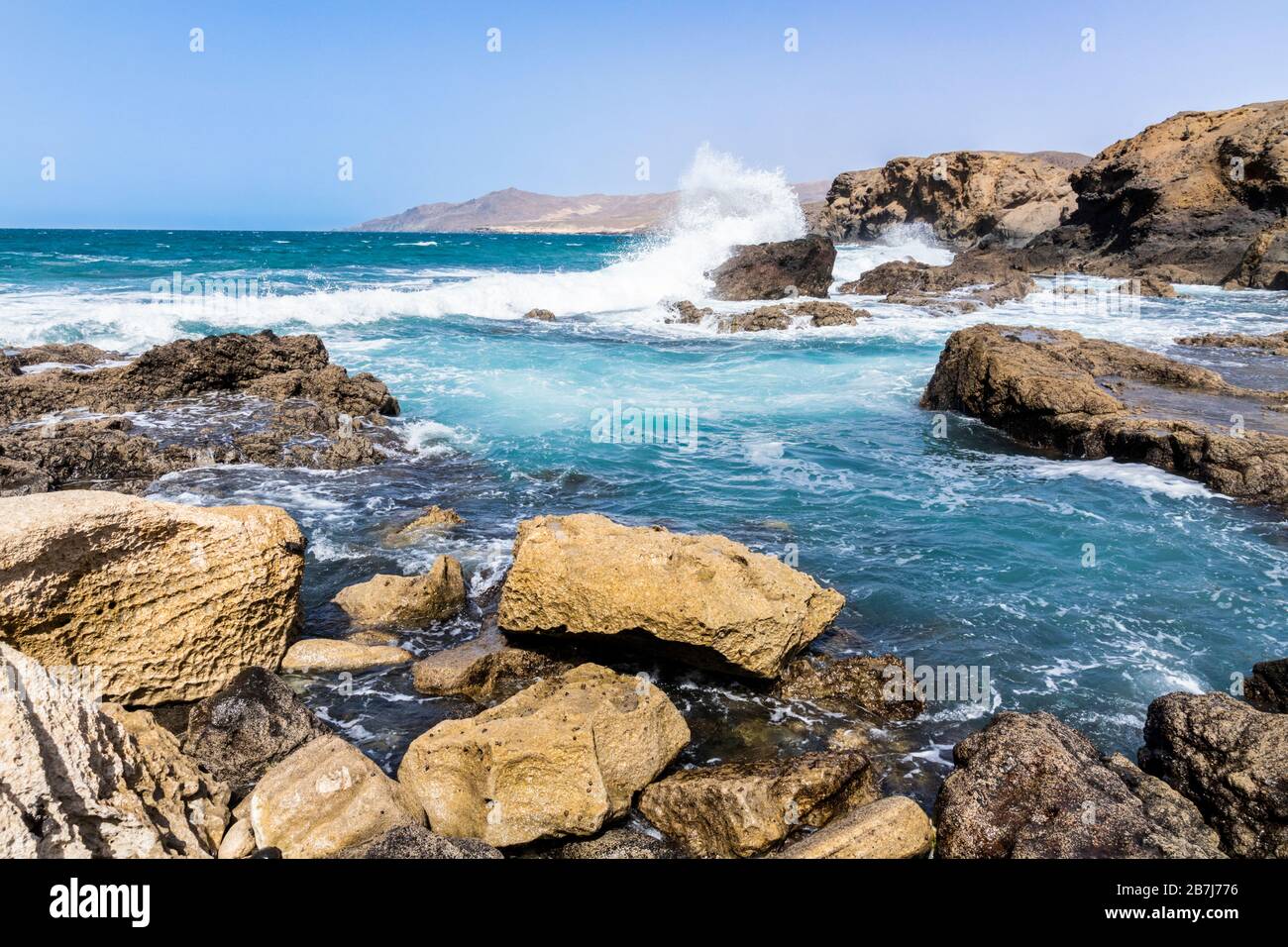 Heavy Atlantic waves breaking on rocks on the beach at La Pared on the west coast of the Canary Island of Fuerteventura Stock Photo