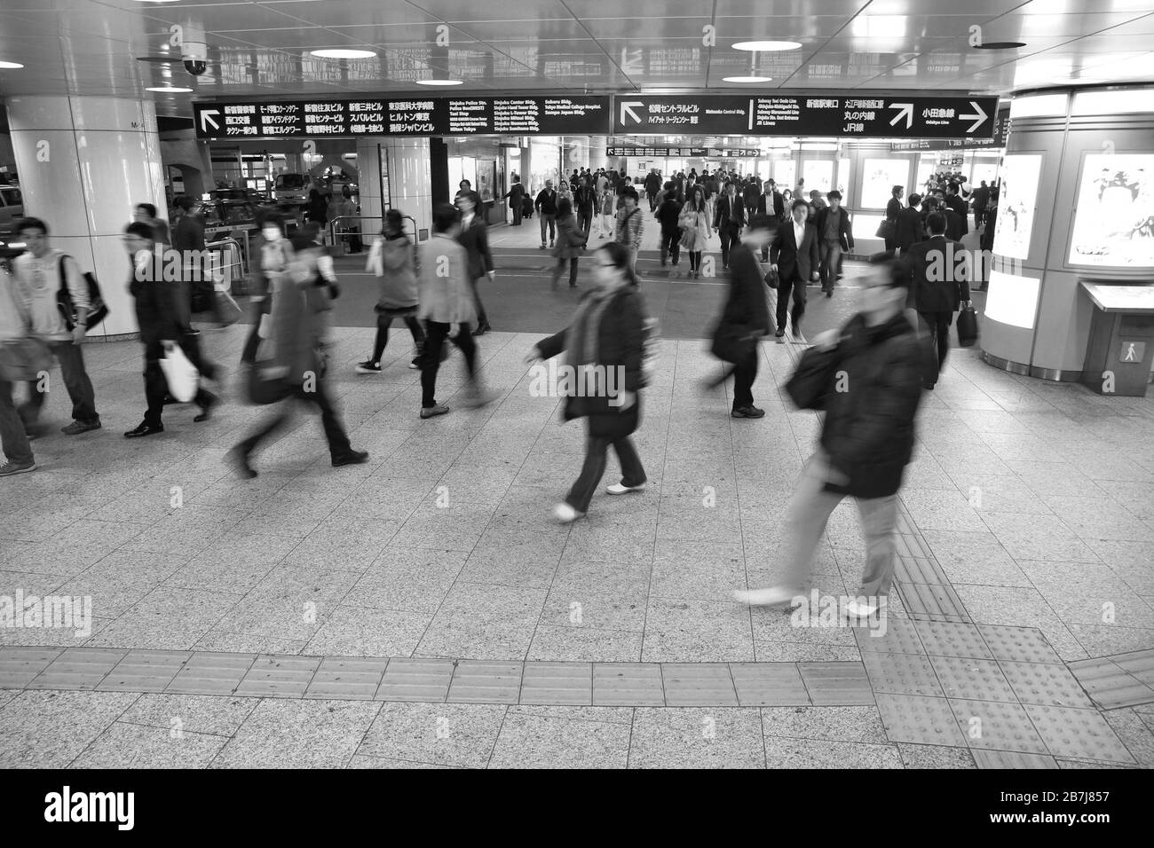 TOKYO, JAPAN - APRIL 13, 2012: People hurry at Shinjuku Station in Tokyo. It is the world's busiest transport hub with daily usage by up to 3.64 milli Stock Photo