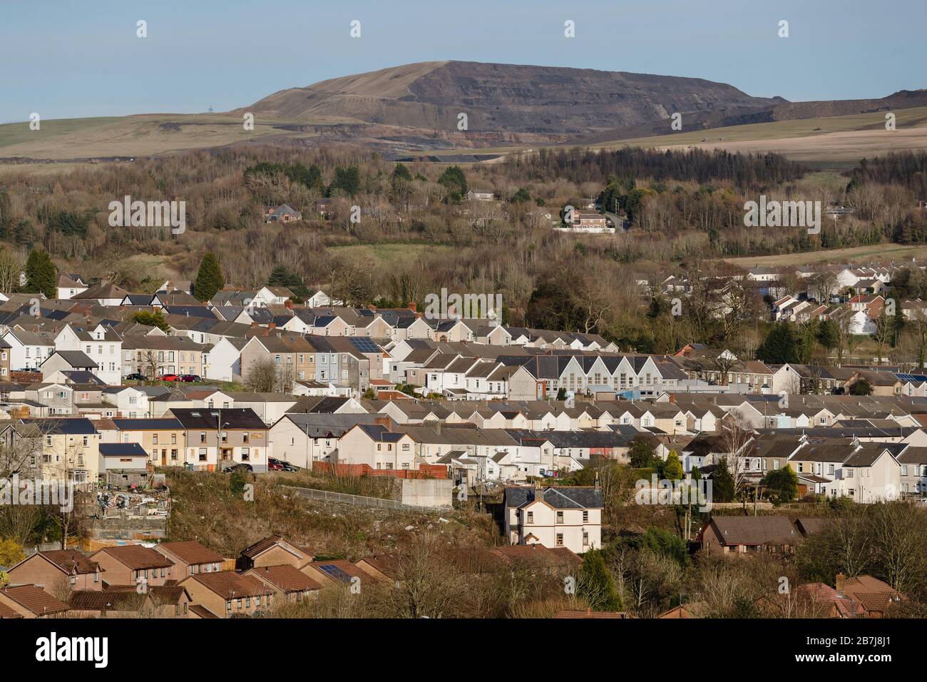 MERTHYR TYDFIL, WALES - 16th March 2020 - Merthyr Tydfil landscape showing terrace housing on a rare sunny day in the Welsh Valleys. Stock Photo