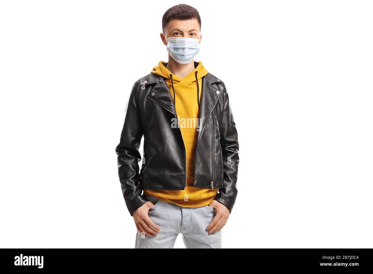 Young guy wearing a medical face mask isolated on white background Stock Photo