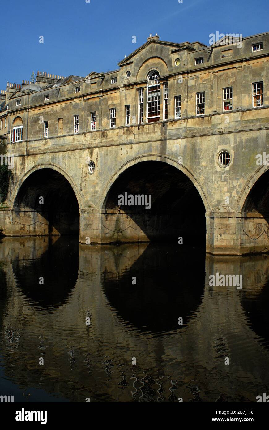 Pulteney Bridge is a rarity. It is one of only four in the world lined by shops on both sides. Bath, North East Somerset Council. United Kingdom (UK). Stock Photo